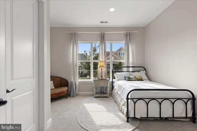 a kitchen with stainless steel appliances kitchen island granite countertop a sink a stove and a wooden floors