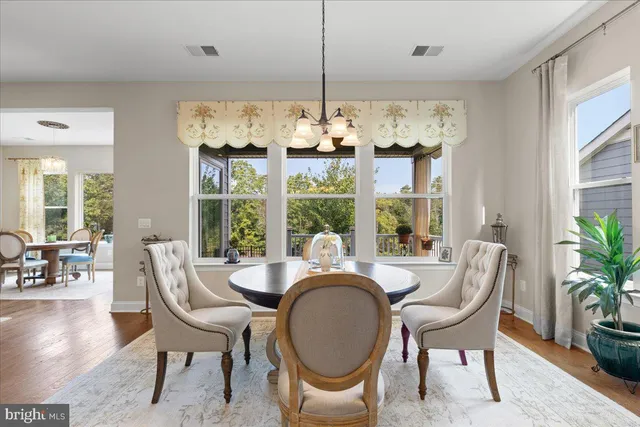 a bedroom with a large bed and a large window