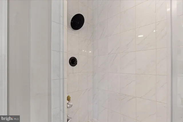 an aerial view of residential houses with outdoor space and swimming pool