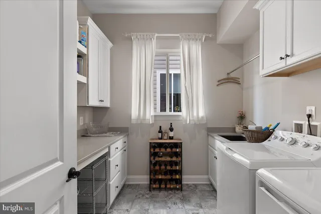 an aerial view of residential houses with outdoor space and swimming pool