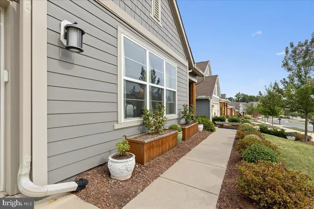 a bedroom with a bed and a mirror