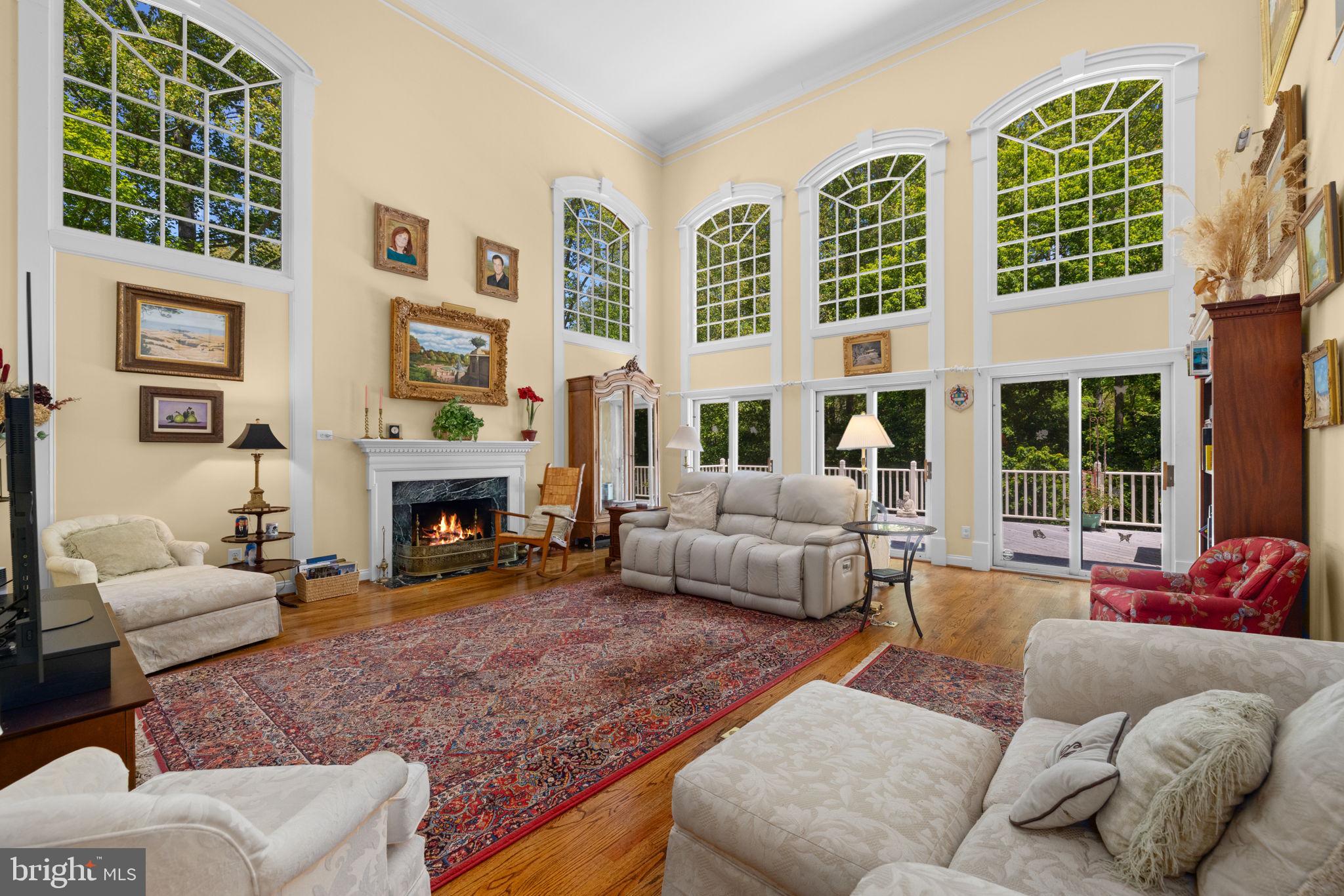 897 Chinquapin Road McLean, VA 22102 - Photo 15 of 66 a living room with furniture large window and a fireplace