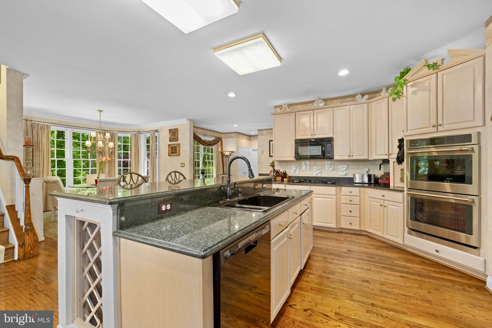 897 Chinquapin Road McLean, VA 22102 - Photo 24 of 66 a kitchen with granite countertop a stove and a sink