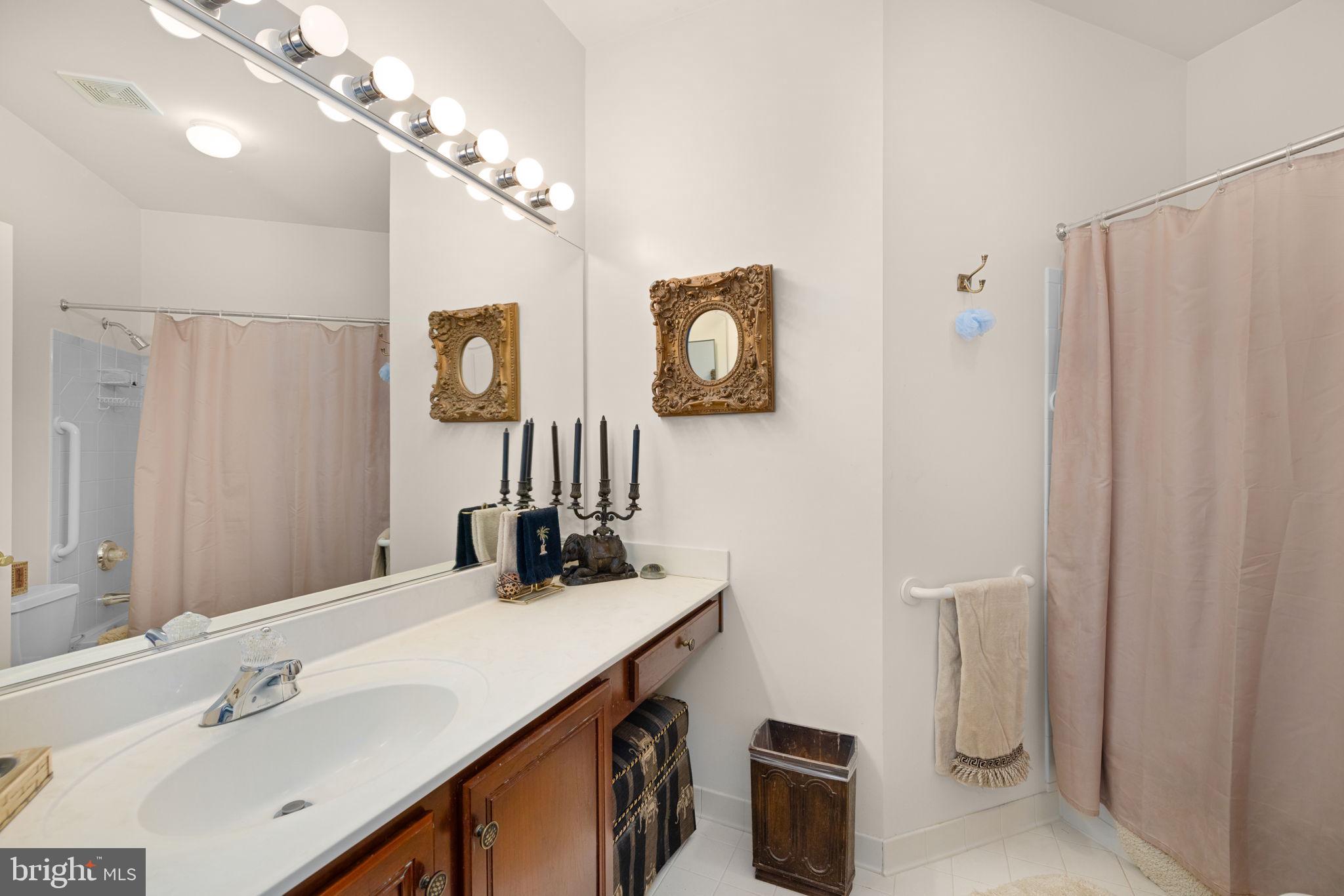 897 Chinquapin Road McLean, VA 22102 - Photo 44 of 66 a bathroom with a sink a toilet and a mirror