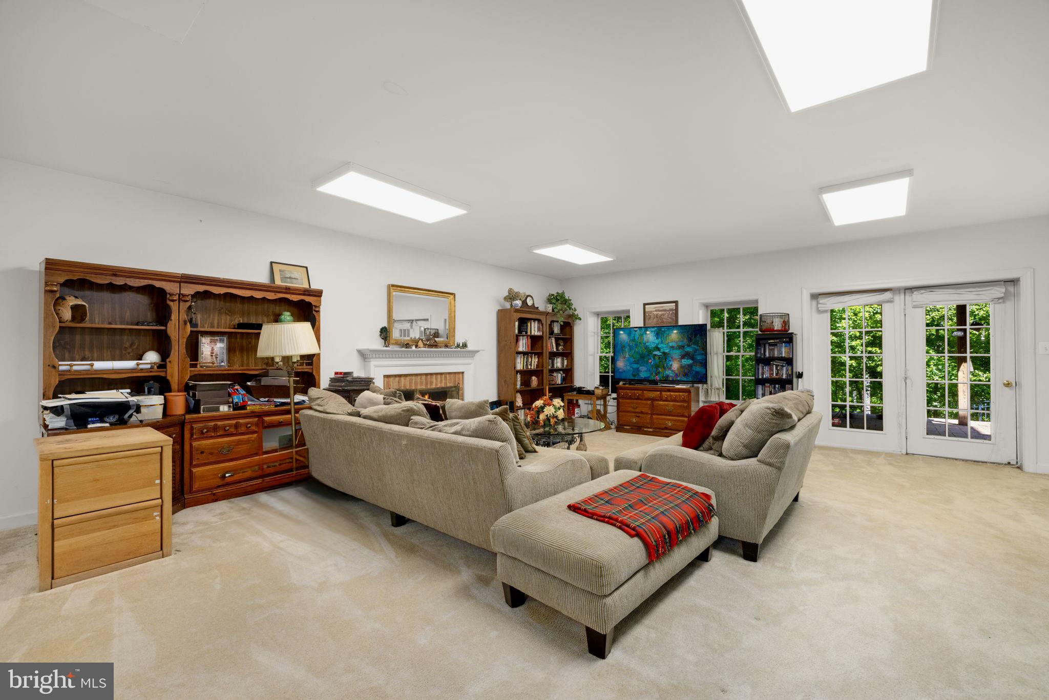 897 Chinquapin Road McLean, VA 22102 - Photo 49 of 66 a living room with furniture and a flat screen tv