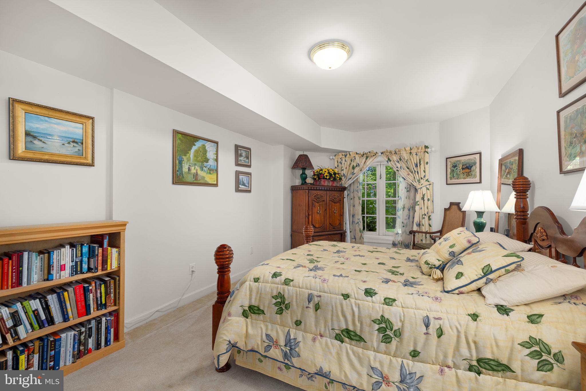 897 Chinquapin Road McLean, VA 22102 - Photo 54 of 66 a bedroom with a bed and a book shelf