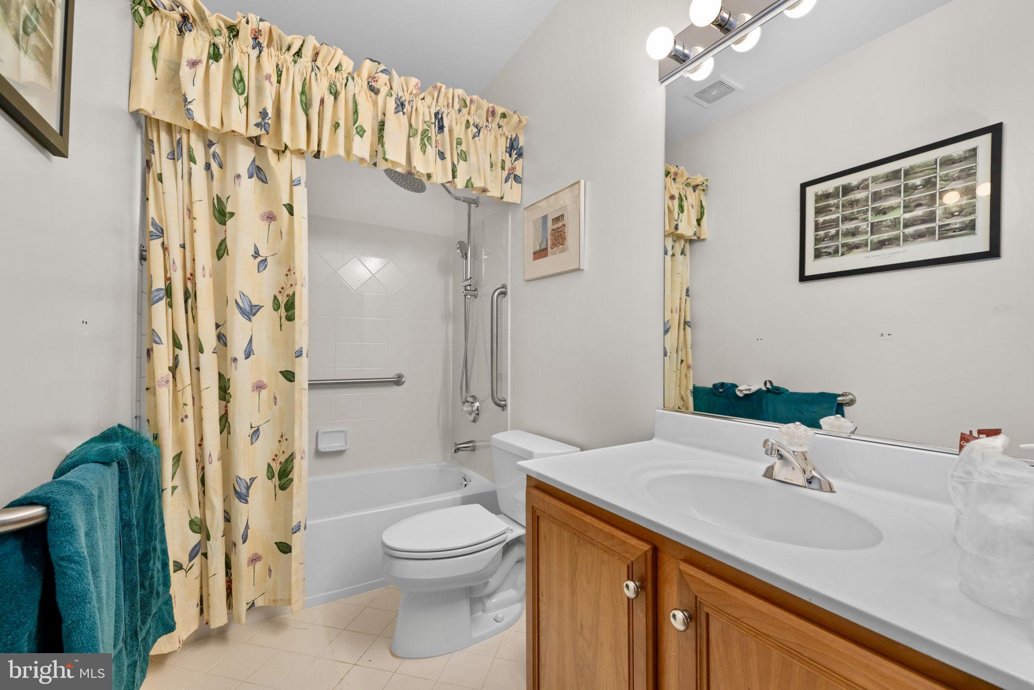 897 Chinquapin Road McLean, VA 22102 - Photo 55 of 66 a bathroom with a sink a toilet and shower