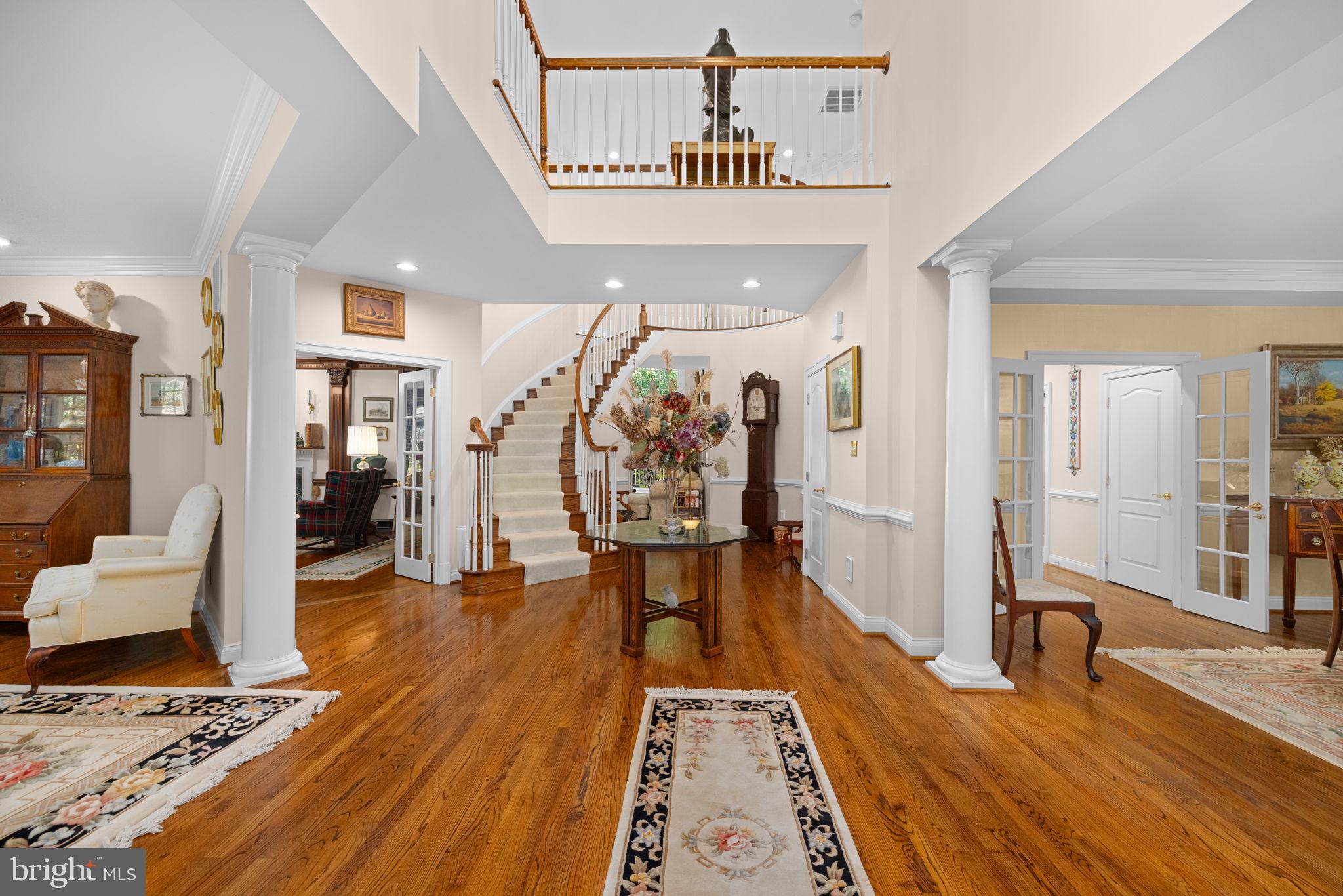 897 Chinquapin Road McLean, VA 22102 - Photo 6 of 66 a view of a hallway with wooden floor and furniture