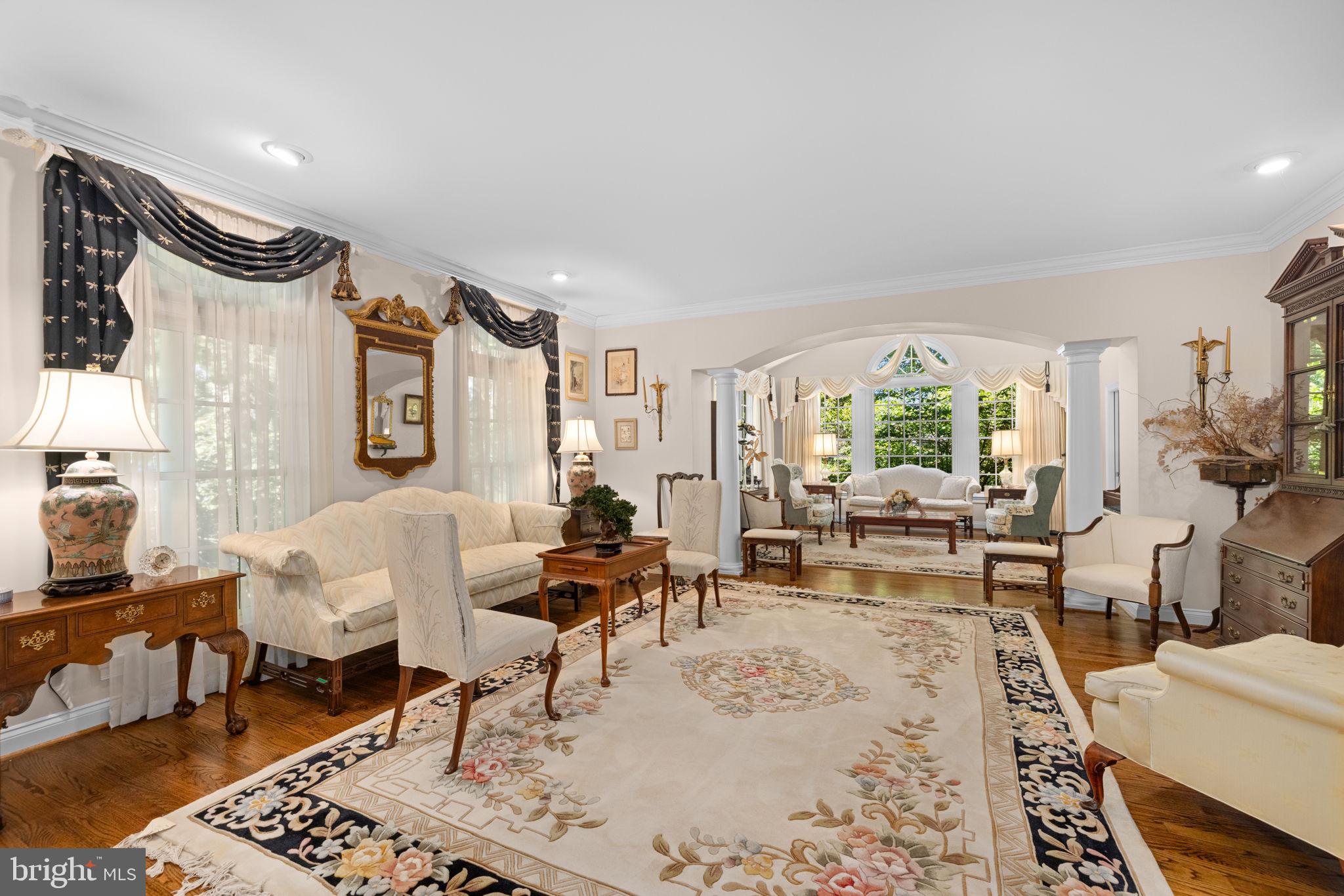 897 Chinquapin Road McLean, VA 22102 - Photo 7 of 66 a living room with furniture wooden floor and a large window