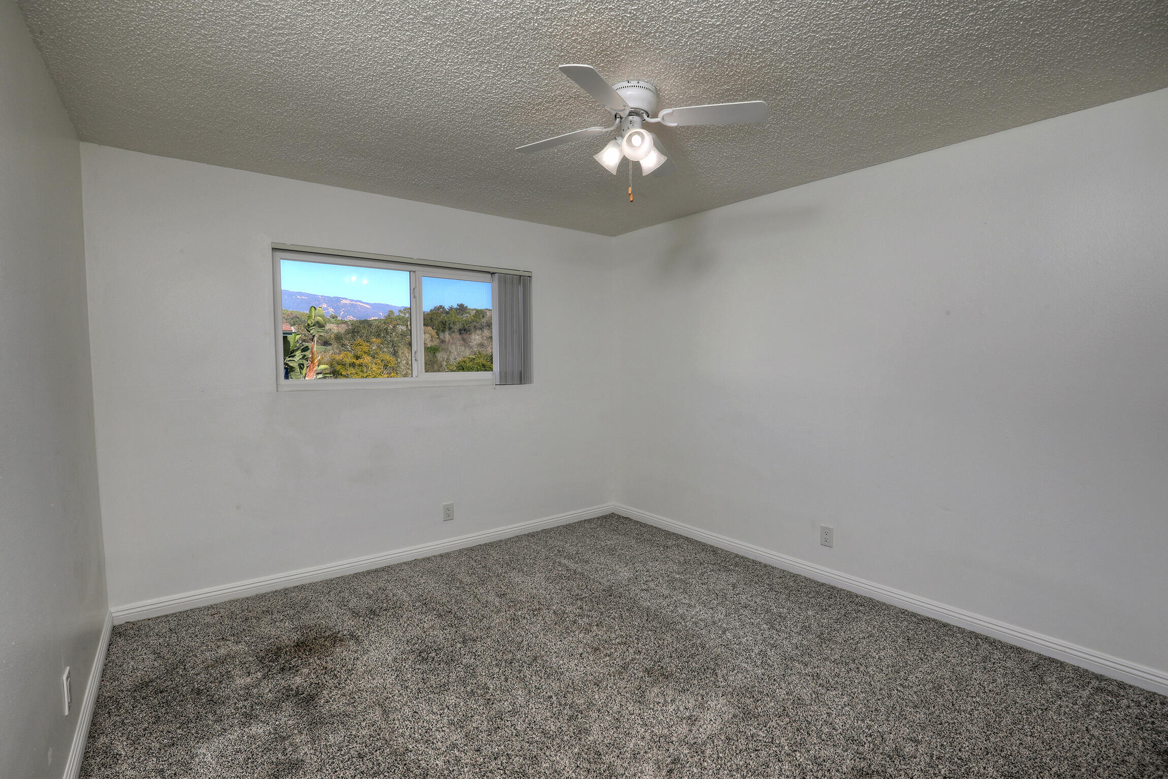 361 Northgate Drive, Unit D Goleta, CA 93117 - Photo 14 of 22 an empty room with a painting on the wall