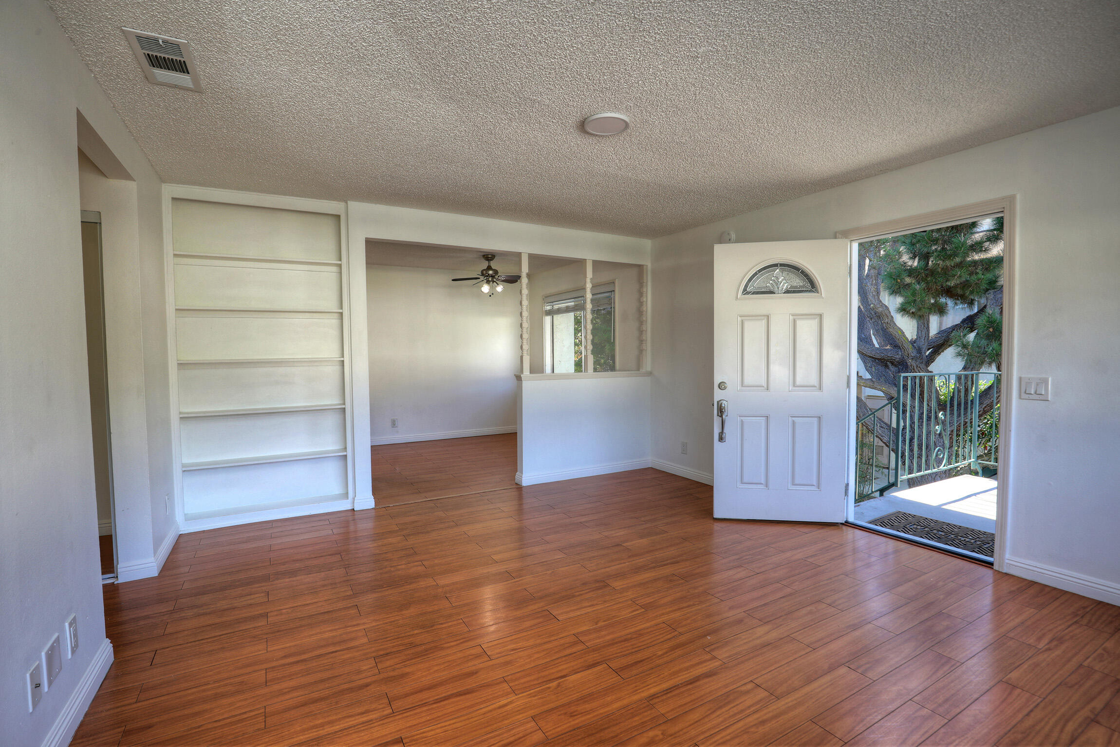 361 Northgate Drive, Unit D Goleta, CA 93117 - Photo 4 of 22 an empty room with wooden floor and windows