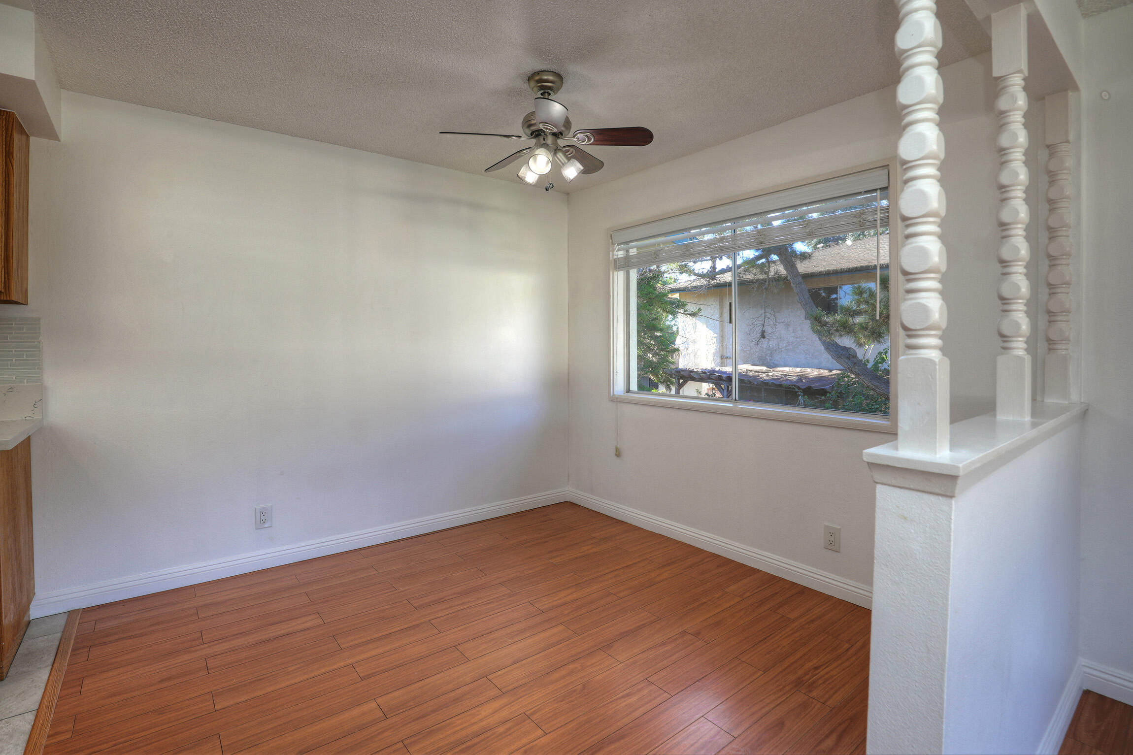 361 Northgate Drive, Unit D Goleta, CA 93117 - Photo 5 of 22 a view of an empty room with wooden floor and a chandelier
