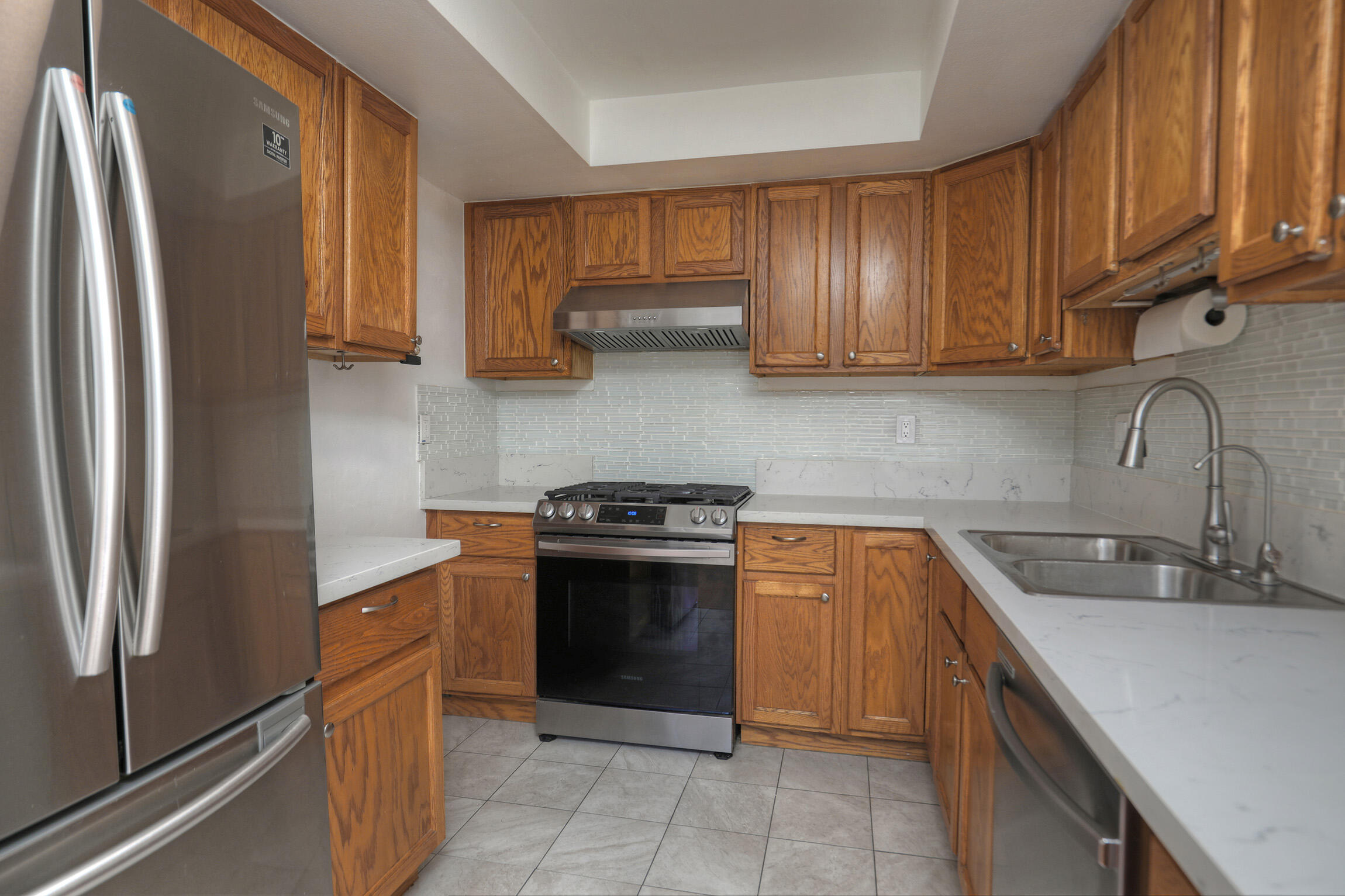 361 Northgate Drive, Unit D Goleta, CA 93117 - Photo 7 of 22 a kitchen with stainless steel appliances granite countertop a refrigerator sink and stove