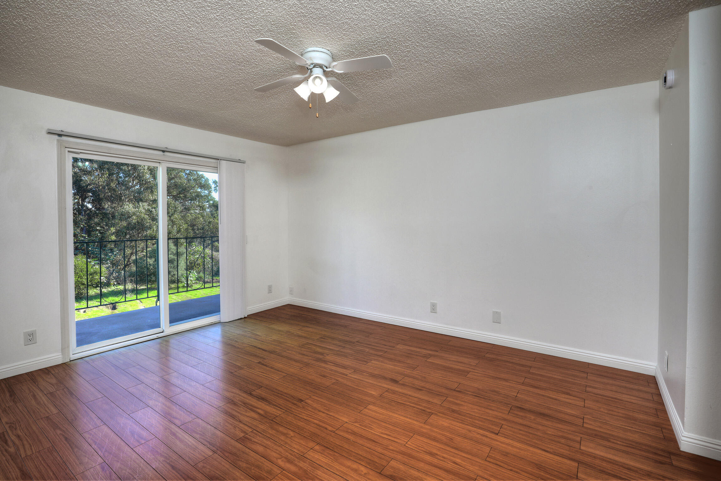 361 Northgate Drive, Unit D Goleta, CA 93117 - Photo 9 of 22 a view of an empty room with wooden floor and a window