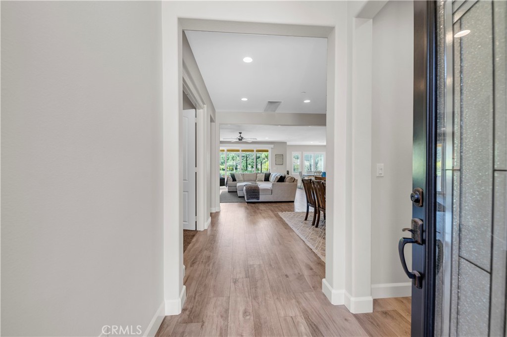 33303 Barmetta Lane Temecula, CA 92592 - Photo 12 of 46 a view of a hallway view with wooden floor and living room