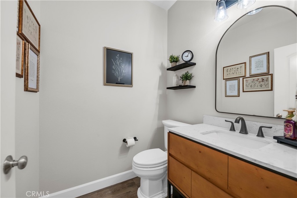 33303 Barmetta Lane Temecula, CA 92592 - Photo 13 of 46 a bathroom with a sink mirror and toilet