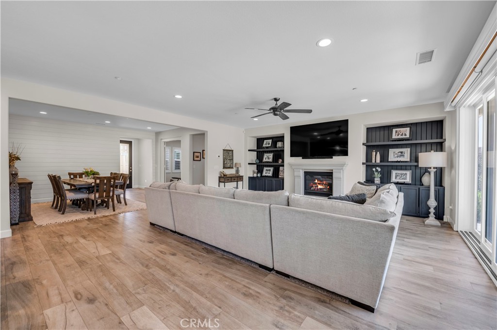 33303 Barmetta Lane Temecula, CA 92592 - Photo 16 of 46 a living room with furniture and a flat screen tv