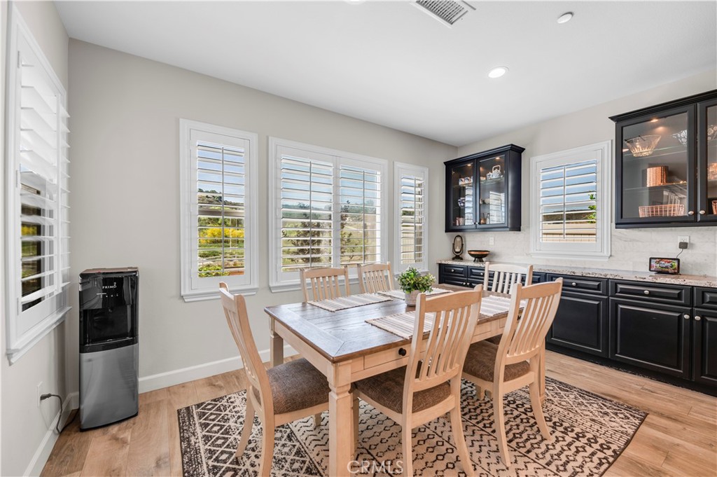 33303 Barmetta Lane Temecula, CA 92592 - Photo 18 of 46 a view of a dining room with furniture