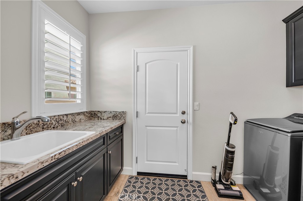 33303 Barmetta Lane Temecula, CA 92592 - Photo 24 of 46 a bathroom with a granite countertop sink toilet and shower
