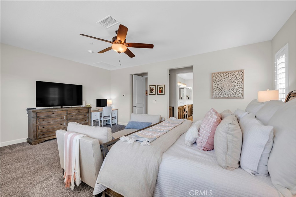 33303 Barmetta Lane Temecula, CA 92592 - Photo 28 of 46 a bedroom with a bed and a flat screen tv