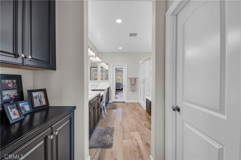 33303 Barmetta Lane Temecula, CA 92592 - Photo 29 of 46 a view of a kitchen with fridge and workspace