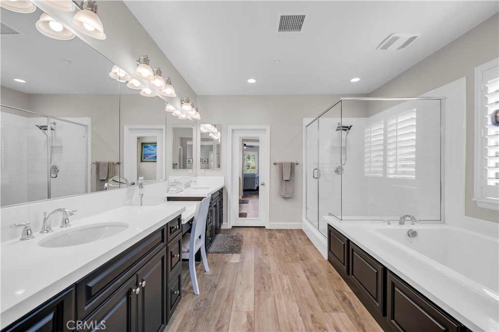 33303 Barmetta Lane Temecula, CA 92592 - Photo 30 of 46 a large bathroom with a large tub sink shower and mirror
