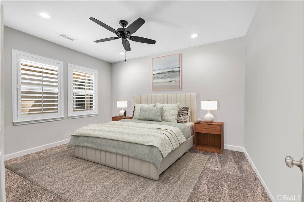 33303 Barmetta Lane Temecula, CA 92592 - Photo 35 of 46 a bedroom with a large bed and a ceiling fan