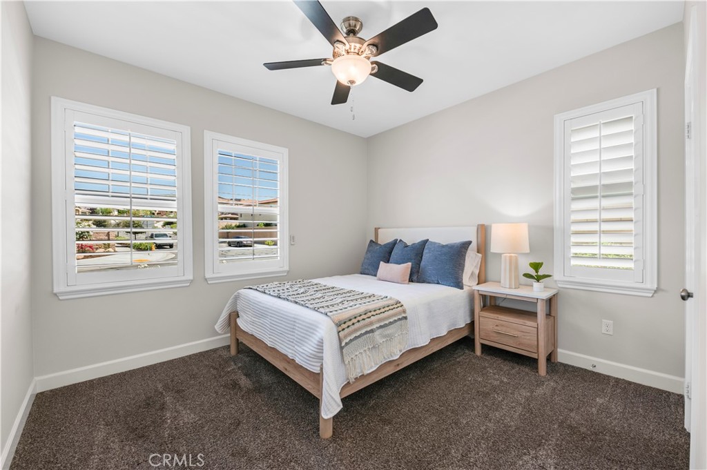 33303 Barmetta Lane Temecula, CA 92592 - Photo 36 of 46 a bed sitting in a bedroom next to a window