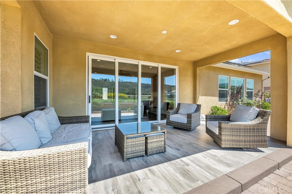 33303 Barmetta Lane Temecula, CA 92592 - Photo 37 of 46 a living room with furniture and a large window