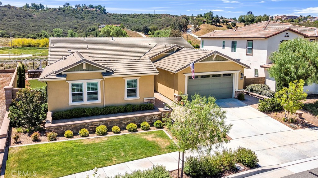 33303 Barmetta Lane Temecula, CA 92592 - Photo 6 of 46 a front view of a house with a yard