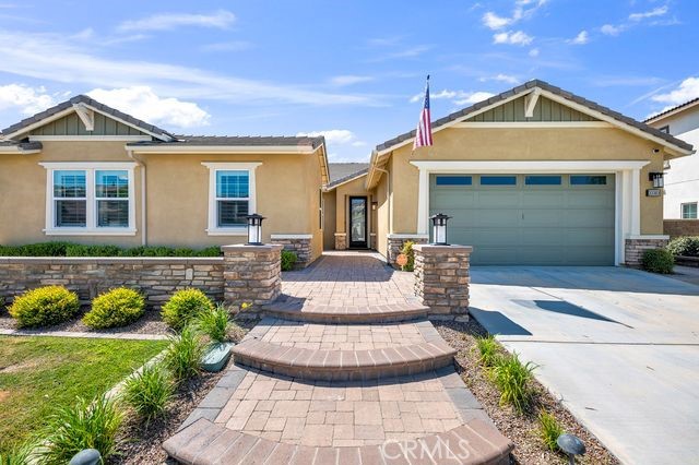 33303 Barmetta Lane Temecula, CA 92592 - Photo 10 of 46 a front view of a house with garden