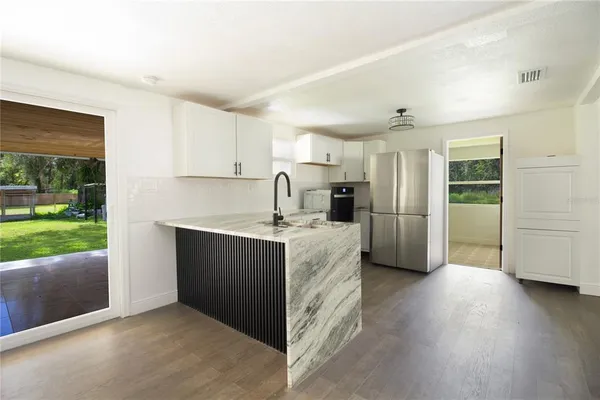 a view of a big room with wooden floor