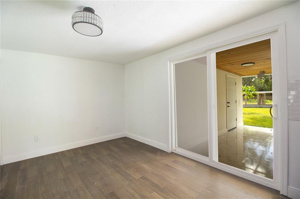 39912 Jerry Road Zephyrhills, FL 33540 - Photo 17 of 59 a view of a room with wooden floor and windows