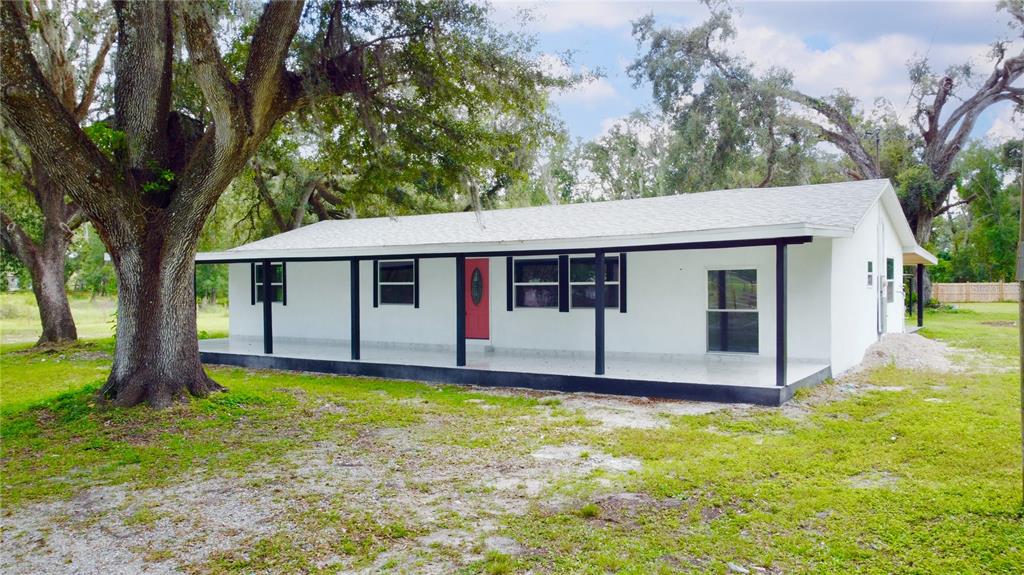 39912 Jerry Road Zephyrhills, FL 33540 - Photo 2 of 59 a view of a house with a yard