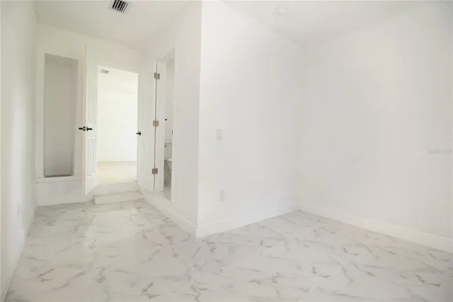 a bathroom with a toilet and shower