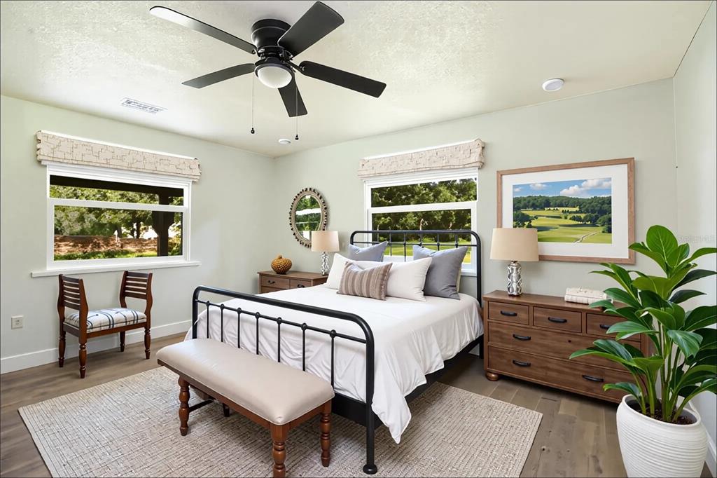 39912 Jerry Road Zephyrhills, FL 33540 - Photo 27 of 59 a bedroom with a large bed and a window