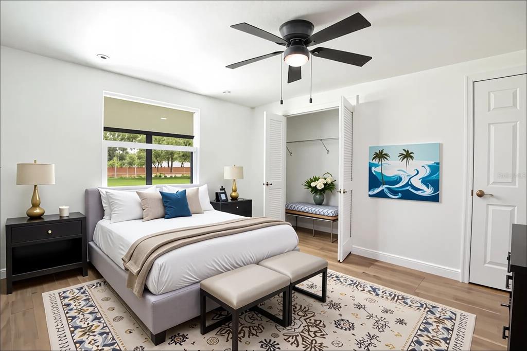 39912 Jerry Road Zephyrhills, FL 33540 - Photo 32 of 59 a bedroom with a bed and a painting on the wall