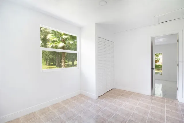 a view of a house with swimming pool and yard