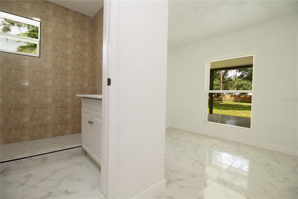 39912 Jerry Road Zephyrhills, FL 33540 - Photo 35 of 59 a view of an empty room with a window