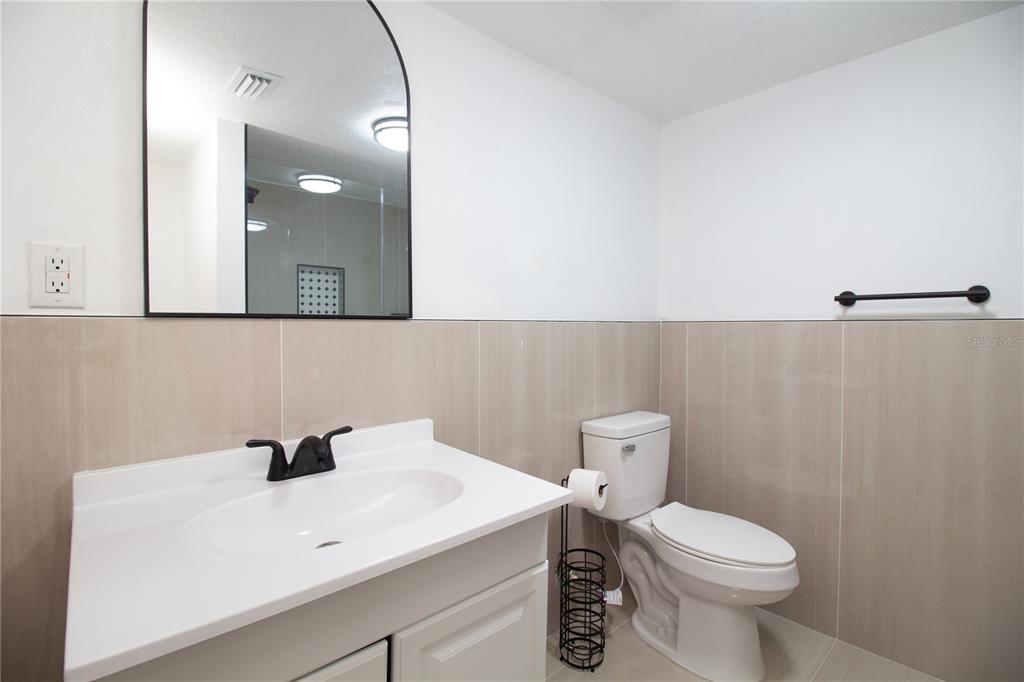 39912 Jerry Road Zephyrhills, FL 33540 - Photo 37 of 59 a bathroom with a sink a toilet and mirror