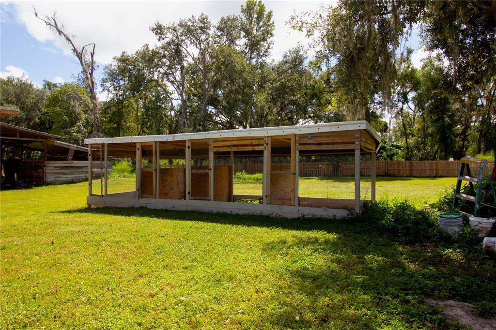 39912 Jerry Road Zephyrhills, FL 33540 - Photo 49 of 59 a view of a house with swimming pool and yard