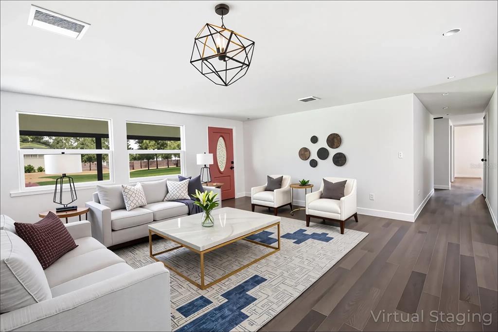 39912 Jerry Road Zephyrhills, FL 33540 - Photo 10 of 59 a living room with furniture and wooden floor