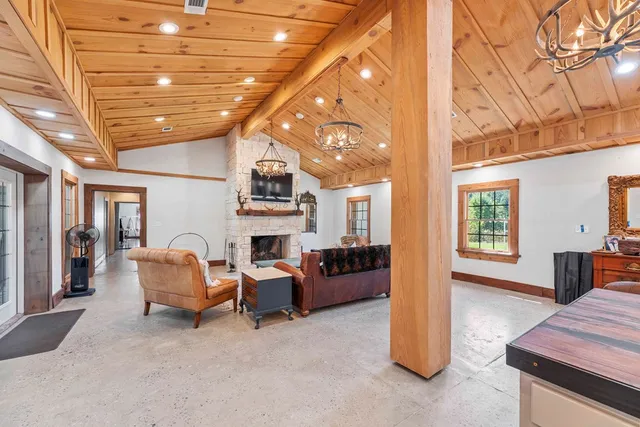 a large kitchen with kitchen island a sink a stove and a dining table