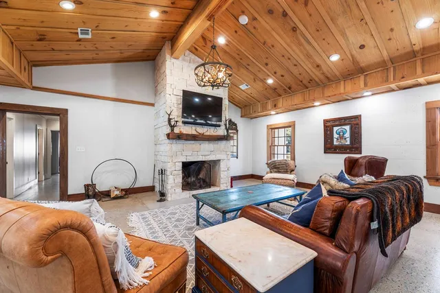 a kitchen with a table chairs and a dining table