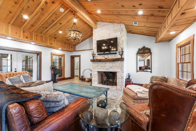 a kitchen with stainless steel appliances kitchen island granite countertop a stove and a refrigerator