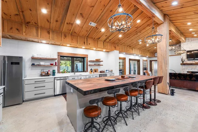 a kitchen with a stove and cabinets