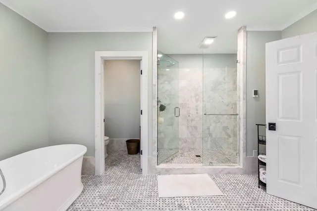 a spacious bathroom with a granite countertop double vanity sink mirror and