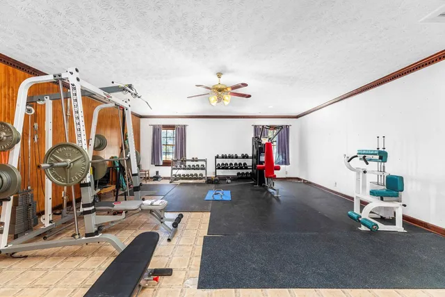 a swimming pool with outdoor seating and yard
