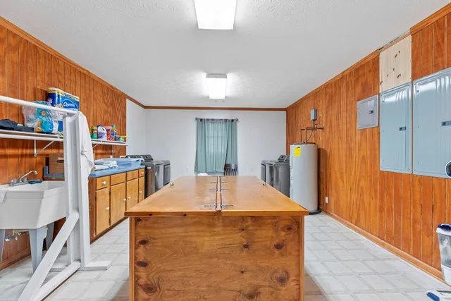 a view of swimming pool with outdoor seating and trees
