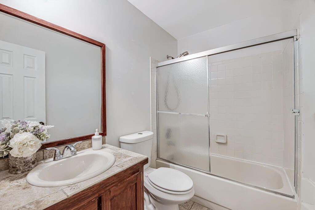 23428 Country Club Drive East Boca Raton, FL 33428 - Photo 25 of 32 a bathroom with a sink toilet and shower